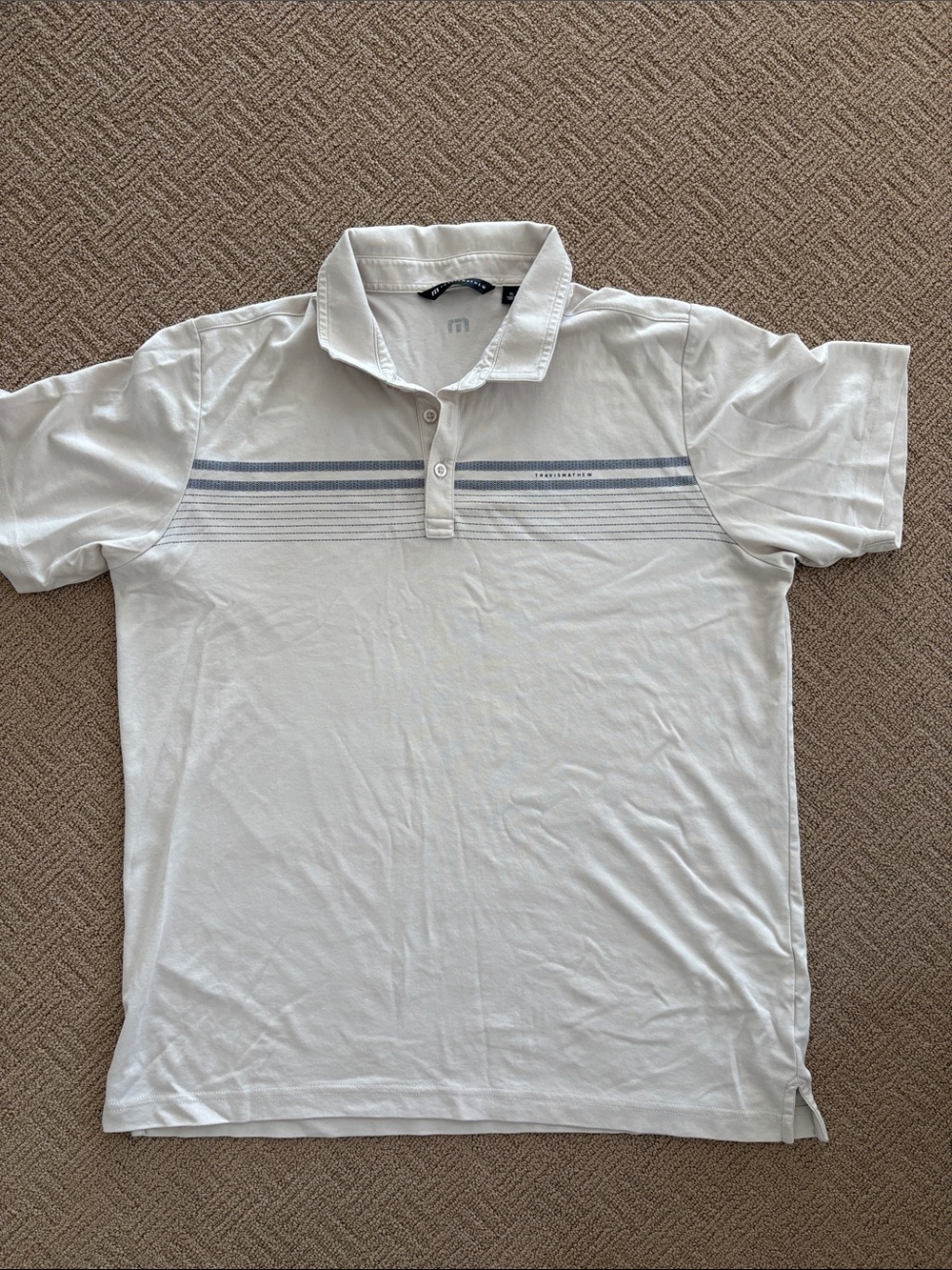 Travis Mathew White Polo with Light Blue Stripe Detail